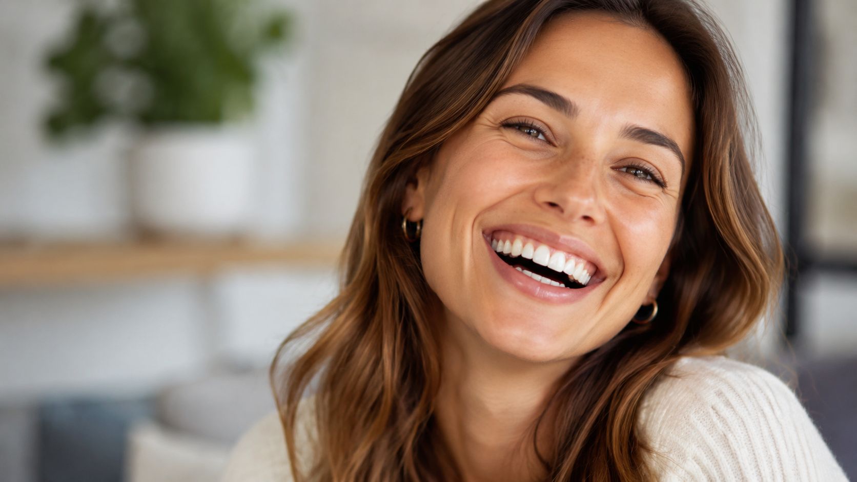 A close-up portrait of a smiling woman with healthy teeth, conveying joy and dental confidence.